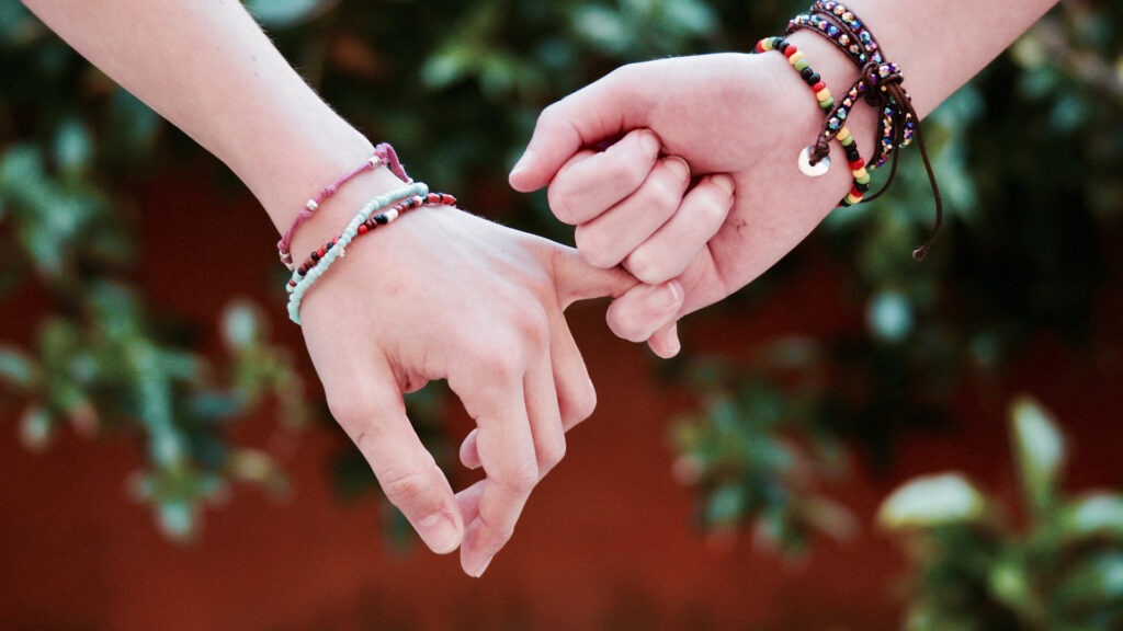 What is codependency? A couple holding hands.