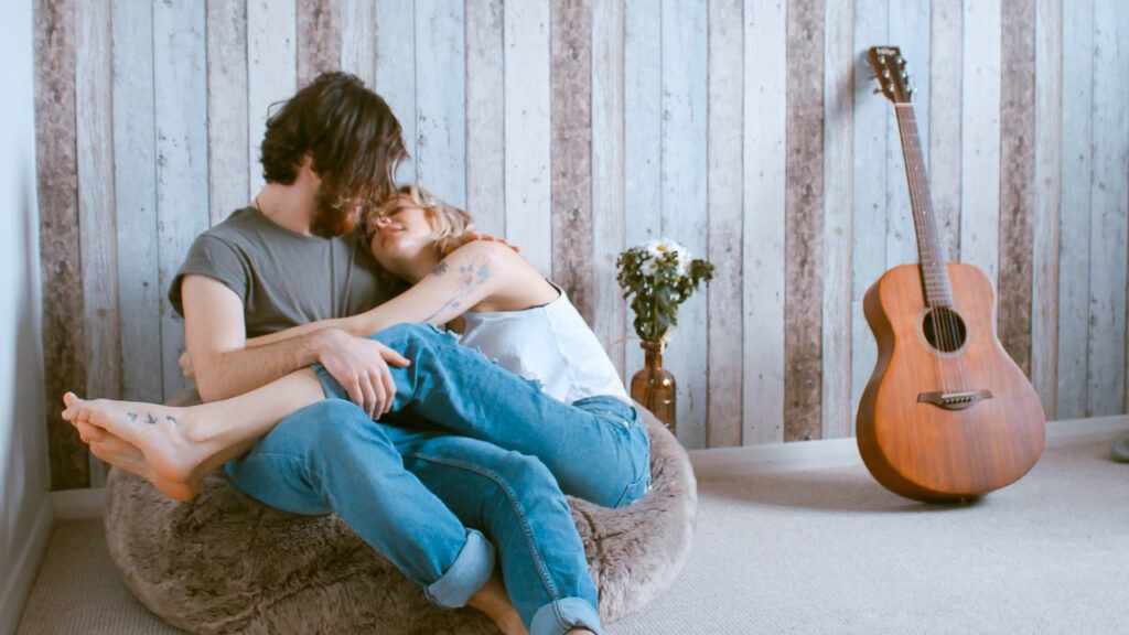 Relationship OCD. Couple cuddling in a room.