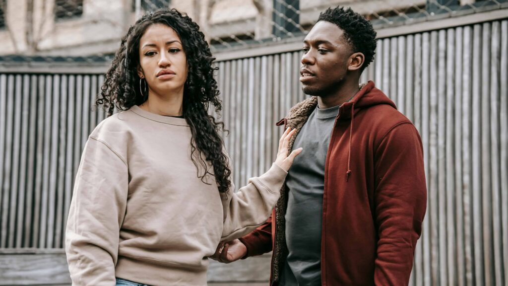 A couple upset in their backyard. From the article: Which attachment style is the most jealous?